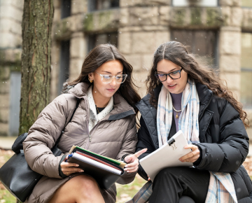 Students sitting on bench in Pittsburgh